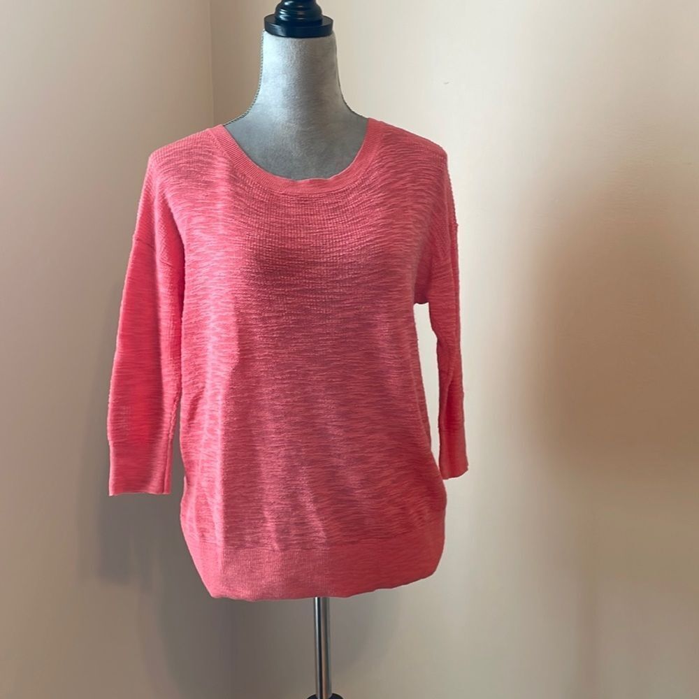 Lightweight pink sweater with knotted back
